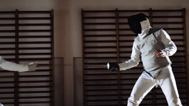 Men In Fencing Masks Thrusting With Foils In Duel — Stockvideo