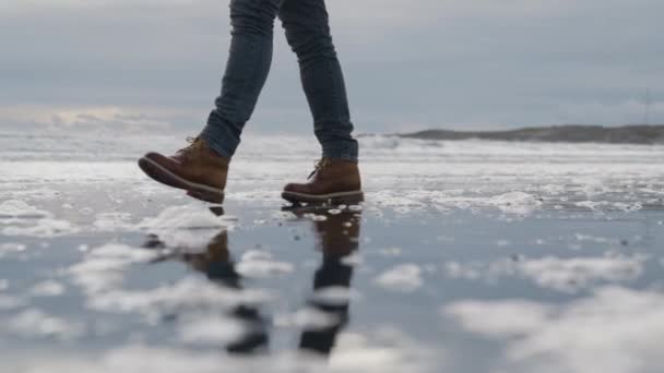 Slow Motion Medium Tracking Shot Man Hiking Boots Walking Wet — стоковое видео