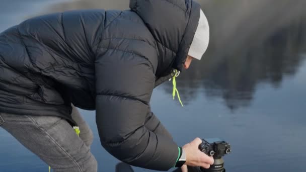 Tracking Slow Motion Medium Shot Photographer Removing Camera Backpack Wet — Video Stock