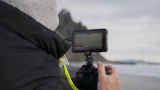 Rack Focus Arcing Slow Motion Shot Photographer Looking Monitor Camera — Αρχείο Βίντεο