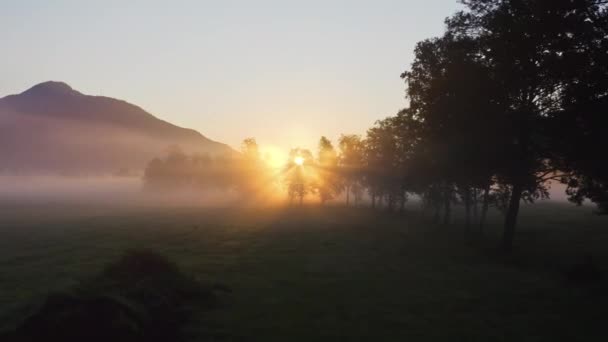 Drone Towards Sunrise Over Misty Landscape Of Zell Am See, — Vídeo de Stock