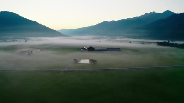 Drone Over Misty Landscape Of Zell Am See To Mountains At Dawn — Stock video