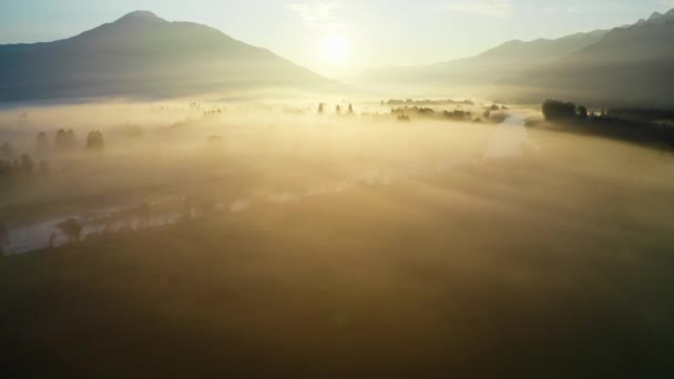 Drone Over Ethereal Misty Landscape Of Zell Am See At Sunrise — Stock video