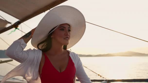 Woman Relaxing On Outrigger Boat In Sun Hat — Stock Video