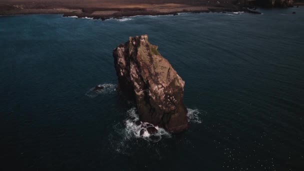 Drone Tilting Down Towards Sea Stack Off The Coast Of KeflavK — Video