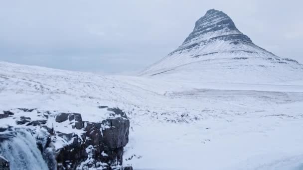 Drone Over Waterfall And Snowy Landscape With Kirkjufell — ストック動画