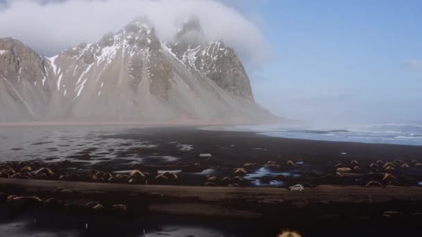 Drone Shot Of Car Driving Along Narrow Track With Sea And Mountain — Vídeos de Stock