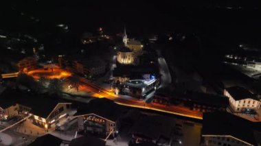 Drone Over Kaprun Buildings, Road And Church At Night