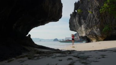 Woman Walking On Shore Of Entalula Beach