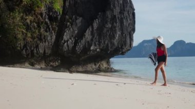 Young Woman Walking Along Entalula Beach
