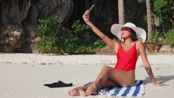 Woman Sitting On Beach Taking Selfie With Smartphone — Stock video