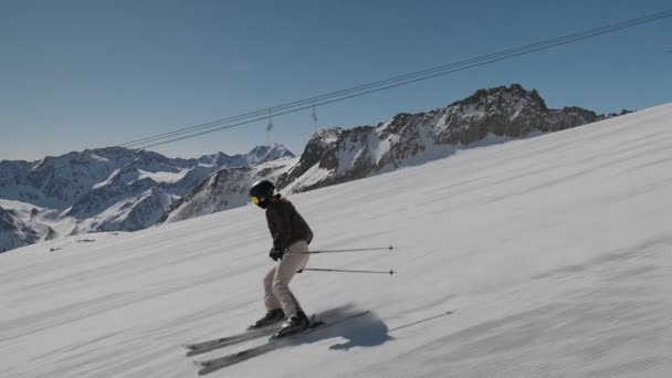 Young Woman Skiing Downhill Slope — Stockvideo