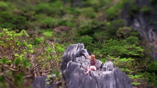 Drone Pulling Away From Woman Taking Selfie On Limestone Rocks — Vídeos de Stock