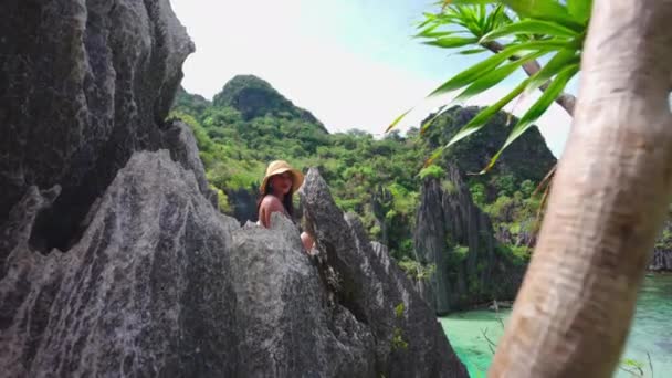 Young Woman In Sun Hat Sitting On Limestone Rocks — Stok Video