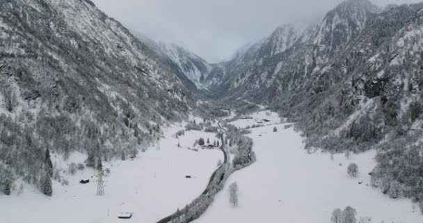 Drone Over Snow Covered Valley With Mountains And River — Stock Video