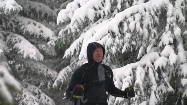 Medium Slow Motion Handheld Tracking Shot Man Ski Touring Snow — Vídeos de Stock