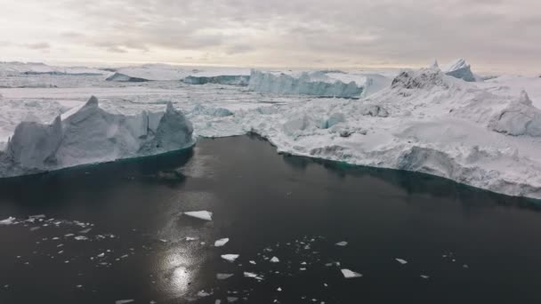 Wide Drone Flight Arcing Sunlit Sea Ice Ilulissat Icefjord Unesco — Wideo stockowe