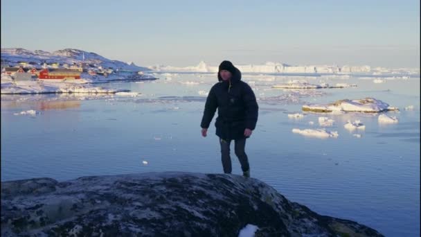 Wide Shot Man Warm Clothing Walking Coast Rocks Ilulissat Icefjord — стокове відео