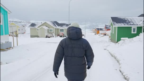 Medium Handheld Slow Motion Tracking Shot Man Winter Coat Walking — Video Stock