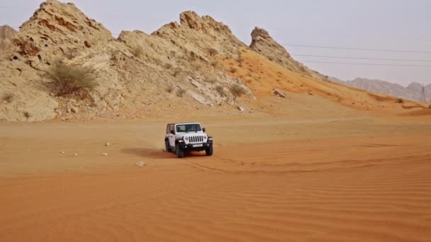 Wide Slow Motion Tracking Shot White Jeep Driving Sand Dune — Stockvideo