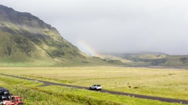 Aerial Car Driving Mud Dirt Road Green Fields Mountain Iceland — Stockvideo