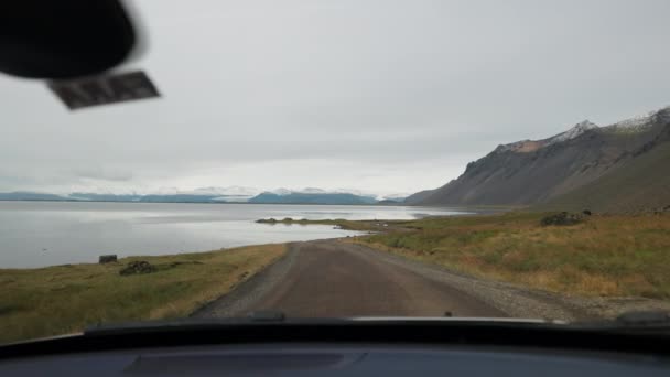 View Moving Car Windshield Dirt Road Fjord Iceland Overcast Day — ストック動画