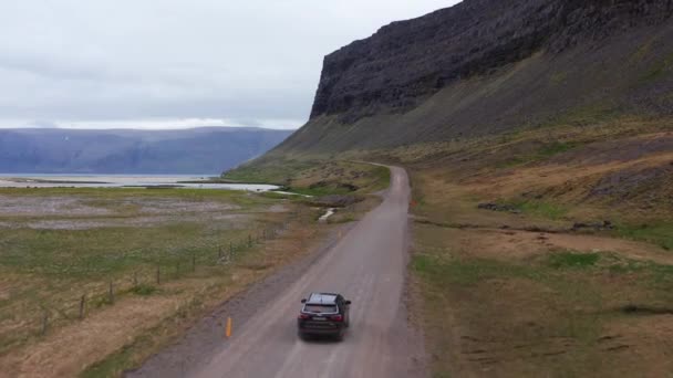 Aerial Car Driving Empty Rural Road Iceland Car Passes Majestic — Stockvideo
