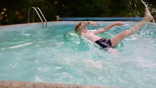 Boy Lays Inflatable Circle Splashing Water His Feet Pool Summer — Stock video