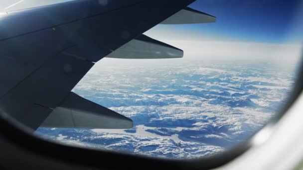 Wide High Angle View Airplane Window Shot Snow Ice Covered — Vídeos de Stock