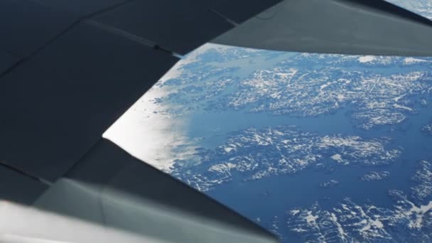 Wide High Angle View Airplane Wing Shot Ice Covered Greenland — Stock video