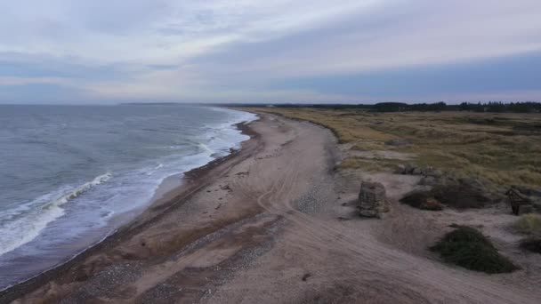 Aerial Empty Beach Overcaste Day Waves Crashing Shore Dolly Out — Vídeos de Stock
