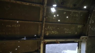 Inside the Fuselage of an Abandoned Crashed Plane on Solheimasandur Beach, Iceland. Popular Tourist Destination. Panning Shot