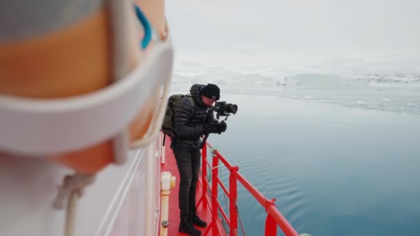 Wide Slow Motion Shot Photographer Standing Deck Boat Filming Sea — ストック動画