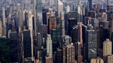 Aerial View of a New York Manhattan Skyscrapers Filmed From a Helicopter. Urban Cityscape. Panoramic Tilt Up Panning Shot