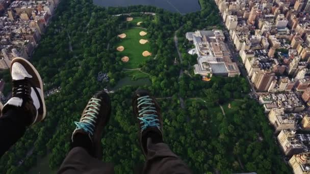 Pov Shot Two Men Legs Dangling Helicopter Flying Central Park — Stock Video
