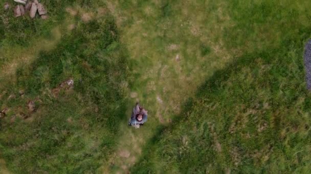 Aerial Man Walks Little Black House White Cross Roof Opens — Video Stock