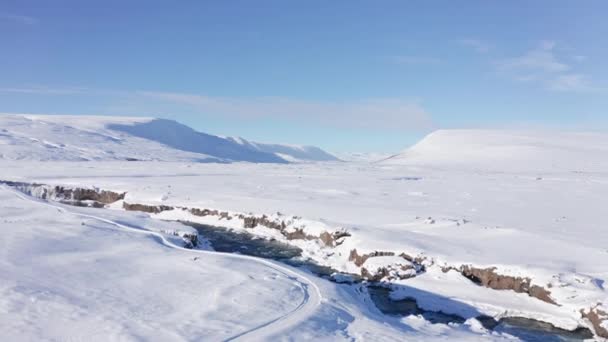 Wide Drone Rising Skjalfandafljot River Snow Covered Landscape Blue Sky — Wideo stockowe