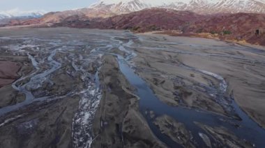 Drone Flight Over Hvannagil Canyon And Estuary Towards Mountains, Iceland