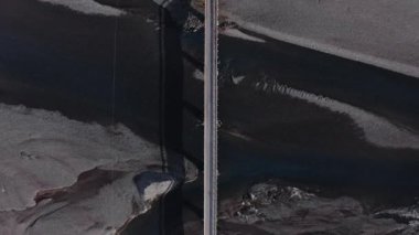 Wide Overhead Drone Flight Rising From Car On Bridge Over Hvannagil Estuary, Iceland