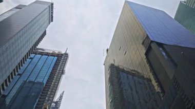Wide Low Angle Dolly Shot Of Modern Skyscraper Reflecting The City, New York, North America