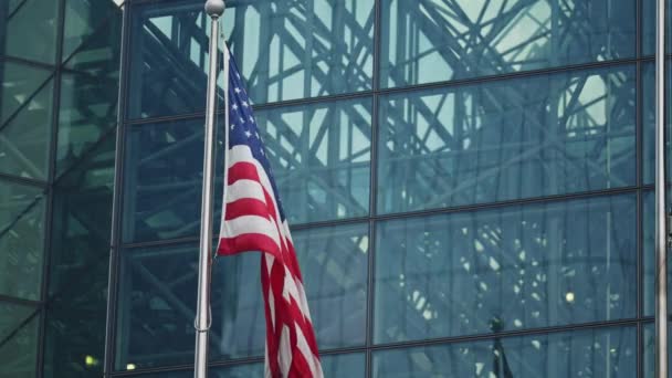 American National Flag Waving Front Modern Skyscraper Glass Facade Slow — Wideo stockowe