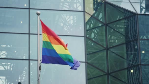 Rainbow Lgbt Pride Flag Waving Front Modern Building Glass Facade — Αρχείο Βίντεο