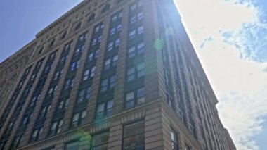 Point Of View Wide Low Angle Shot Moving Through New York City Streets With Blocks Of Apartments And Buildings