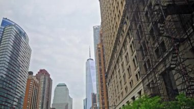 Wide Dolly Low Angle Shot Moving Between New York City Skyscrapers Towards One World Trade Centre