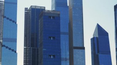Modern High Rising Glass Buildings of Manhattan with Reflections on Windows, New York. Panning Shot
