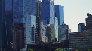 Modern High Rising Glass Buildings of Manhattan with Reflections on Windows, New York. Panning Shot