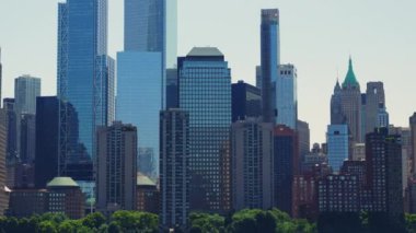 Modern High Rising Glass Buildings of Manhattan with Reflections on Windows, New York. Trucking Right Shot