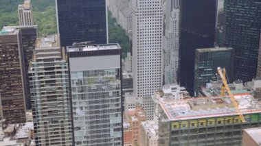Roof Tops of High Rising Skyscrapers in Midtown Manhattan, New York. Urban Cityscape. Panning Shot