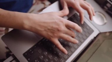 Close-up of Womans Hands Typing on a Laptop While Going by Train. Slow Motion Top Down Shot