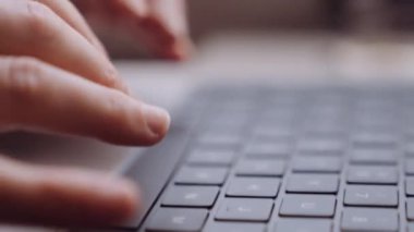 Close-up of Womans Hands Typing on a Laptop While Going by Train. Slow Motion Shallow Focus Shot